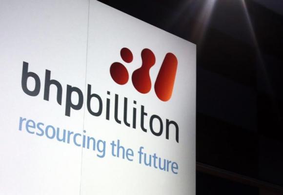 A promotional sign adorns a stage at a BHP Billiton function in central Sydney