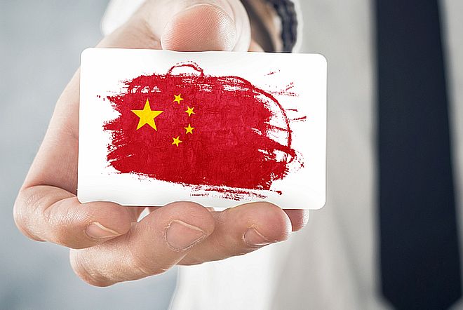 Chinese Businessman holding business card with China Flag